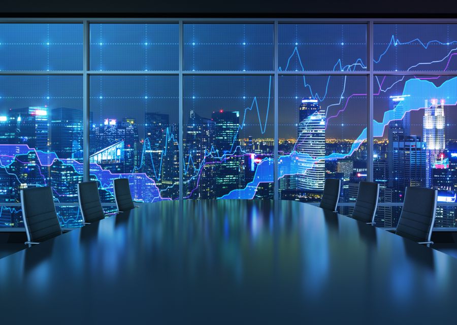 Forex graph and an amazing night view of the business city area. A metaphor of international financial consulting.